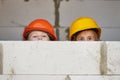 Boy and girl playing on construction site Royalty Free Stock Photo