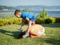 Two children playing leap frog outdoors Royalty Free Stock Photo