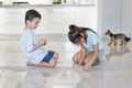 Boy and girl playing mikado game. Children playing pick up sticks Royalty Free Stock Photo