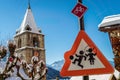 Boy and girl playing on a roadsign Royalty Free Stock Photo