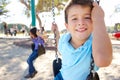 Boy And Girl Playing On Swing In Park Royalty Free Stock Photo