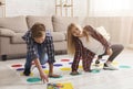 Boy And Girl Playing Twister Game Together On Floor Indoor Royalty Free Stock Photo