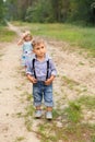 Boy and girl playing in the woods Royalty Free Stock Photo