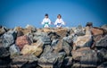 Boy and girl practising yoga on beach Royalty Free Stock Photo