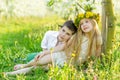 A boy and a girl are resting in a blooming garden in the spring Royalty Free Stock Photo