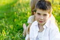 A boy and a girl are resting in a blooming garden in the spring Royalty Free Stock Photo