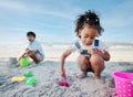 Boy, girl and shovel with bucket, beach and digging sand with playing, outdoor and vacation in summer. Kids, siblings Royalty Free Stock Photo