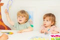 Boy and a girl show weather cards sitting in kindergarten class Royalty Free Stock Photo