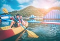 Boy and girl siblings on a canoe boat in a fun lake for summer activity Royalty Free Stock Photo
