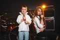 Boy and girl singing in recording studio Royalty Free Stock Photo