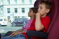 Boy and girl sit in chairs in bus Royalty Free Stock Photo