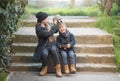 A boy and a girl sit on a suitcase and play around Royalty Free Stock Photo