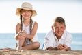 Boy and girl sitting beach Royalty Free Stock Photo