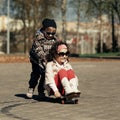 Boy and girl skating on the street Royalty Free Stock Photo