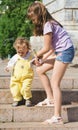 Boy and girl on a stair in a city park Royalty Free Stock Photo