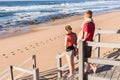 Boy Girl Stairs Beach Waves Royalty Free Stock Photo