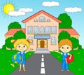 Boy and girl standing near the school building in a schoolyard Royalty Free Stock Photo