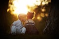 Boy and girl on sunset Royalty Free Stock Photo