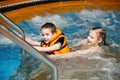 Boy and girl swimming in jacuzzi Royalty Free Stock Photo