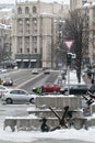 A boy and a girl swing on an anti-tank hedgehog - Banksy graffiti in Kyiv, Ukraine