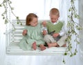 Boy and Girl on Swing with Bunny Royalty Free Stock Photo