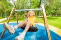 Boy and girl swing in opposite directions Royalty Free Stock Photo