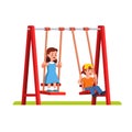 Boy and girl swinging on swing on playground Royalty Free Stock Photo