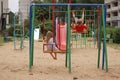 Boy with a girl swinging on a swing Royalty Free Stock Photo