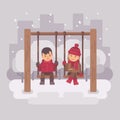 Boy and girl on swings in a winter city park. Two cute children Royalty Free Stock Photo