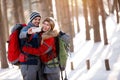 Boy and girl taking photo in snowy nature Royalty Free Stock Photo