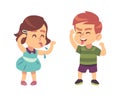 Boy and girl teasing each other. Naughty preschooler show tongue, happy children funny games, bad manners kids conflict Royalty Free Stock Photo