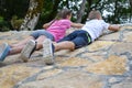 Boy and girl play on mountain. children tourists travelers climb mountain.