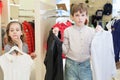 The boy with the girl trying on clothes Royalty Free Stock Photo