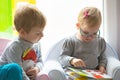 Boy and girl twins reading book Royalty Free Stock Photo