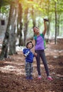 Boy and girl using binoculars and exploring together Royalty Free Stock Photo