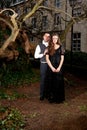 Boy and girl in Victorian clothing in the park