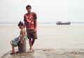 Boy and girl are waiting on the wharf in Mumbai Royalty Free Stock Photo