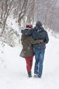 Boy and girl walking in the snow Royalty Free Stock Photo