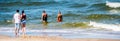 A boy with a girl watching people in the sea Royalty Free Stock Photo