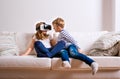 Boy and girl wearing virtual reality goggles. Studio shot Royalty Free Stock Photo