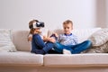 Boy and girl wearing virtual reality goggles. Studio shot Royalty Free Stock Photo