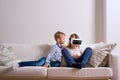 Boy and girl wearing virtual reality goggles. Studio shot Royalty Free Stock Photo