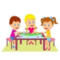 Boy and girls draw at the table