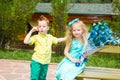 The boy gives a flower to a girl child on happy birthday. Celebration concept and childhood, love Royalty Free Stock Photo