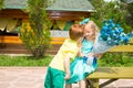 The boy gives a flower to a girl child on happy birthday. Celebration concept and childhood, love Royalty Free Stock Photo