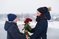 Boy gives a girl a bouquet of roses Royalty Free Stock Photo