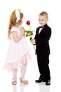 The boy gives the girl a flower. Royalty Free Stock Photo