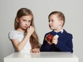 Boy gives a girl gift.little beautiful couple.kids