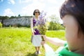 The boy gives his mother a bouquet of flowers Royalty Free Stock Photo