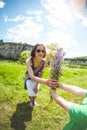 The boy gives his mother a bouquet of flowers Royalty Free Stock Photo